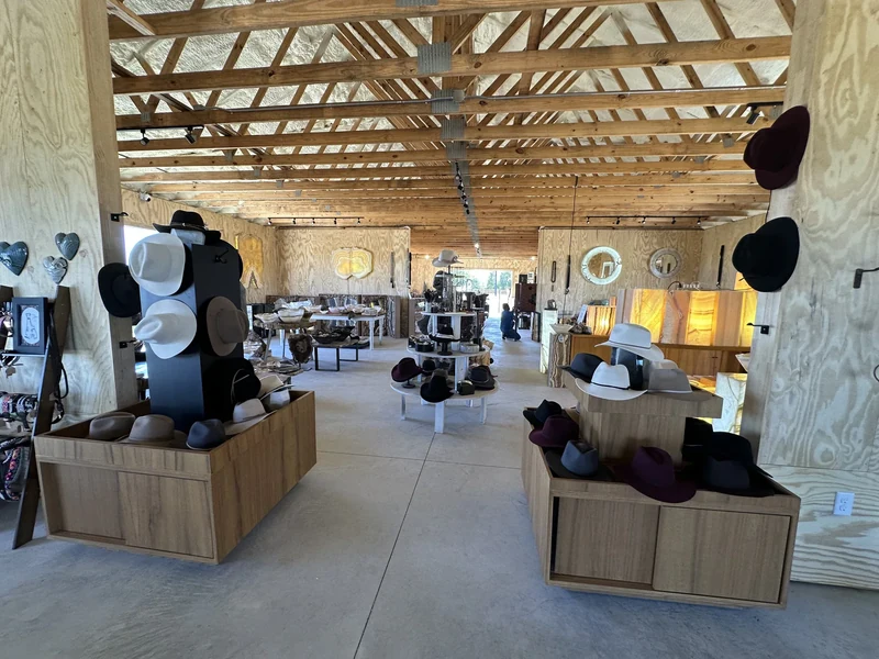 Wide interior of The Hive permanent barn with vendor displays