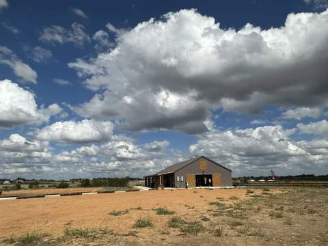 The Hive venue beneath a wide Texas sky